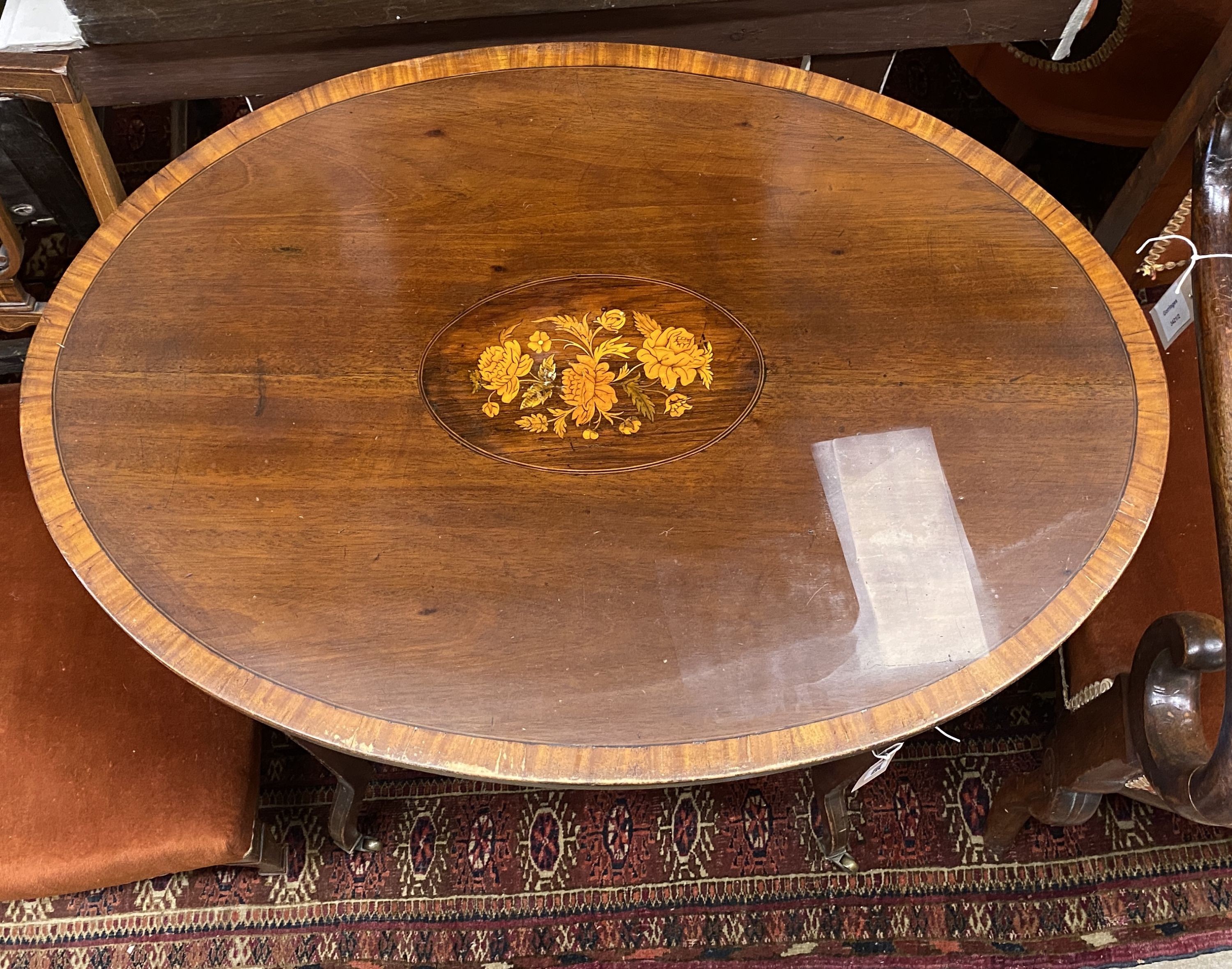 An Edwardian oval marquetry inlaid mahogany two tier occasional table, width 76cm, depth 54cm, height 69cm